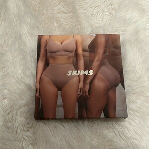 Brand new, never worn. Skims high waist thong shapewear. Onyx 2X/3X